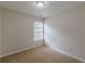 The room features a large window and neutral carpet at 1732 Broad River Rd, Atlanta, GA 30349