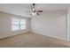 Spacious bedroom features ceiling fan and carpet at 1732 Broad River Rd, Atlanta, GA 30349
