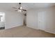 Spacious bedroom with a ceiling fan and a door to bathroom at 1732 Broad River Rd, Atlanta, GA 30349