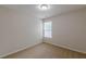 Well-lit bedroom with neutral carpeting and a window at 1732 Broad River Rd, Atlanta, GA 30349