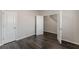 Bedroom with dark wood flooring, white doors, and base trim at 1732 Broad River Rd, Atlanta, GA 30349