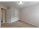 Comfortable bedroom with neutral carpeting and room access at 1732 Broad River Rd, Atlanta, GA 30349