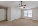 Bright bedroom features a ceiling fan and large window at 1732 Broad River Rd, Atlanta, GA 30349