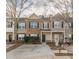 Traditional townhome featuring a well-manicured lawn and inviting facade at 1732 Broad River Rd, Atlanta, GA 30349