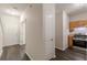 Hallway view of kitchen, utility closet, and entryway at 1732 Broad River Rd, Atlanta, GA 30349