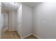 Hallway with neutral carpeting, showcasing closet and room access at 1732 Broad River Rd, Atlanta, GA 30349
