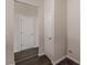 Hallway with closet door view of an additional doorway at 1732 Broad River Rd, Atlanta, GA 30349
