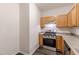 Kitchen featuring stainless steel appliances and wood cabinetry at 1732 Broad River Rd, Atlanta, GA 30349