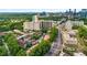 Panoramic aerial view of the residential community nestled among lush greenery and city skyline at 3777 Peachtree Ne Rd # 911, Atlanta, GA 30319