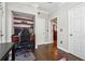 Bedroom features built in shelving, hardwood floors, and a modern desk space at 3777 Peachtree Ne Rd # 911, Atlanta, GA 30319