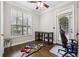 Charming bedroom with hardwood floors, a ceiling fan, and a large window for natural light at 3777 Peachtree Ne Rd # 911, Atlanta, GA 30319