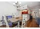 Bright dining area with hardwood floors, access to kitchen, and a modern chandelier at 3777 Peachtree Ne Rd # 911, Atlanta, GA 30319