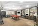 Spacious game room featuring a pool table, bar seating, and desk work space at 3777 Peachtree Ne Rd # 911, Atlanta, GA 30319