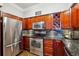 Gourmet kitchen features stainless steel appliances, granite countertops, and custom wood cabinets at 3777 Peachtree Ne Rd # 911, Atlanta, GA 30319