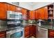 Gourmet kitchen features stainless steel appliances, granite countertops, and custom wood cabinets at 3777 Peachtree Ne Rd # 911, Atlanta, GA 30319
