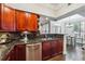 Kitchen boasts granite counters, stainless appliances, and adjacent breakfast area at 3777 Peachtree Ne Rd # 911, Atlanta, GA 30319