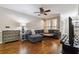Comfortable living room with hardwood floors, a sectional sofa, and views through the windows at 3777 Peachtree Ne Rd # 911, Atlanta, GA 30319