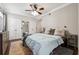 Comfortable main bedroom features hardwood floors, ceiling fan, and large closet at 3777 Peachtree Ne Rd # 911, Atlanta, GA 30319