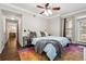 Comfortable main bedroom features hardwood floors, ceiling fan, and backyard access at 3777 Peachtree Ne Rd # 911, Atlanta, GA 30319