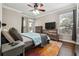Comfortable main bedroom features hardwood floors, ceiling fan, and backyard access at 3777 Peachtree Ne Rd # 911, Atlanta, GA 30319