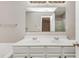 Bathroom features a double sink vanity, large mirror and white cabinets at 745 Crestwell Sw Cir, Atlanta, GA 30331