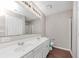 Bathroom features a double sink vanity, large mirror and white cabinets at 745 Crestwell Sw Cir, Atlanta, GA 30331