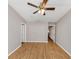 Bedroom featuring hardwood floors, a ceiling fan, and two entry doors to other parts of the home at 745 Crestwell Sw Cir, Atlanta, GA 30331