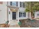 Close up on house exterior, featuring a front door with classic columns and a small garden at 745 Crestwell Sw Cir, Atlanta, GA 30331