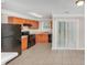 Eat-in kitchen features stainless steel appliances and access to outdoor space via sliding glass door at 745 Crestwell Sw Cir, Atlanta, GA 30331