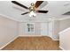 Bright living room featuring hardwood floors, ceiling fan, and neutral wall paint at 745 Crestwell Sw Cir, Atlanta, GA 30331