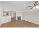 Open living area with a fireplace, sliding glass doors to patio, and hardwood floors at 745 Crestwell Sw Cir, Atlanta, GA 30331