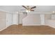Open-concept living area with hardwood floors, ceiling fan, and white trim at 745 Crestwell Sw Cir, Atlanta, GA 30331