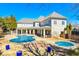 Expansive backyard with covered pool and patio area perfect for outdoor entertaining and relaxation at 2817 Middlecreek Way # 1703, Cumming, GA 30041
