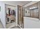 Spacious bathroom with walk-in closet and glass shower featuring neutral-colored tiling and natural light at 2817 Middlecreek Way # 1703, Cumming, GA 30041