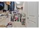 Walk-in closet with ample storage, shelving, and a variety of clothing and accessories at 2817 Middlecreek Way # 1703, Cumming, GA 30041