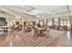 Spacious common area with ample seating, tables, and a chandelier, ideal for community events and socializing at 2817 Middlecreek Way # 1703, Cumming, GA 30041