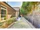 Well-maintained lawn along a pathway bordered by mature trees provides a peaceful outdoor setting at 2817 Middlecreek Way # 1703, Cumming, GA 30041