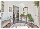 Welcoming foyer with hardwood floors, plants, and a view into the dining area at 2817 Middlecreek Way # 1703, Cumming, GA 30041