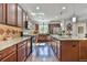 Open kitchen featuring stainless steel appliances, granite countertops, and hardwood floors, ideal for cooking and entertaining at 2817 Middlecreek Way # 1703, Cumming, GA 30041