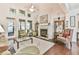 Bright living room featuring a fireplace, hardwood floors, and stylish decor at 2817 Middlecreek Way # 1703, Cumming, GA 30041