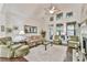 Inviting living room with high ceilings, fireplace, and an array of natural light at 2817 Middlecreek Way # 1703, Cumming, GA 30041