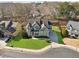 Aerial view of the home, showcasing its location on a well-manicured lot with lush lawn at 2952 Perimeter Cir, Buford, GA 30519