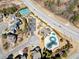 An aerial view of community amenities includes a playground, splashpad, and tennis courts for active lifestyles at 2952 Perimeter Cir, Buford, GA 30519