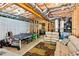 Partially finished basement with ping pong table and seating area, offering entertainment and relaxation space at 2952 Perimeter Cir, Buford, GA 30519