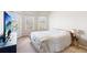 Bright bedroom featuring large windows, a TV, and comfortable bedding at 2952 Perimeter Cir, Buford, GA 30519