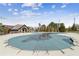 Community pool covered for the off-season, near the clubhouse, with a spacious patio deck area at 2952 Perimeter Cir, Buford, GA 30519