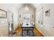 Charming dining room with wainscotting, modern chandelier, and ample natural light at 2952 Perimeter Cir, Buford, GA 30519