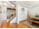 View of the foyer leading to a dining area and living room with hardwood floors and natural light at 2952 Perimeter Cir, Buford, GA 30519