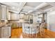 Bright kitchen with granite countertops, wooden cabinetry, and an island with bar stool seating at 2952 Perimeter Cir, Buford, GA 30519