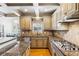 Bright kitchen with granite countertops, stainless steel appliances, and a view into the breakfast nook at 2952 Perimeter Cir, Buford, GA 30519